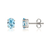9ct White Gold Oval Natural Swiss Blue Topaz Claw Stud Earrings — 7x5mm