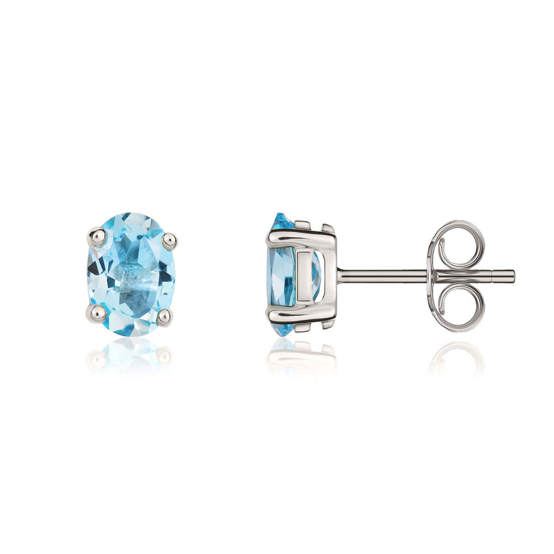 9ct White Gold Oval Natural Swiss Blue Topaz Claw Stud Earrings — 7x5mm