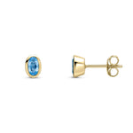 9ct Yellow Gold Oval Natural Swiss Blue Topaz Rubover Stud Earrings — 5x3mm