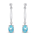 9ct White Gold Oval Natural Swiss Blue Topaz Claw Bar Drop Earrings — 7x5mm
