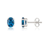 9ct White Gold Oval Natural London Blue Topaz Claw Stud Earrings — 7x5mm