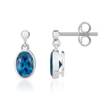 9ct White Gold Oval Natural London Blue Topaz Rubover Drop Earrings — 7x5mm
