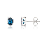 9ct White Gold Oval Natural London Blue Topaz Rubover Stud Earrings — 6x4mm