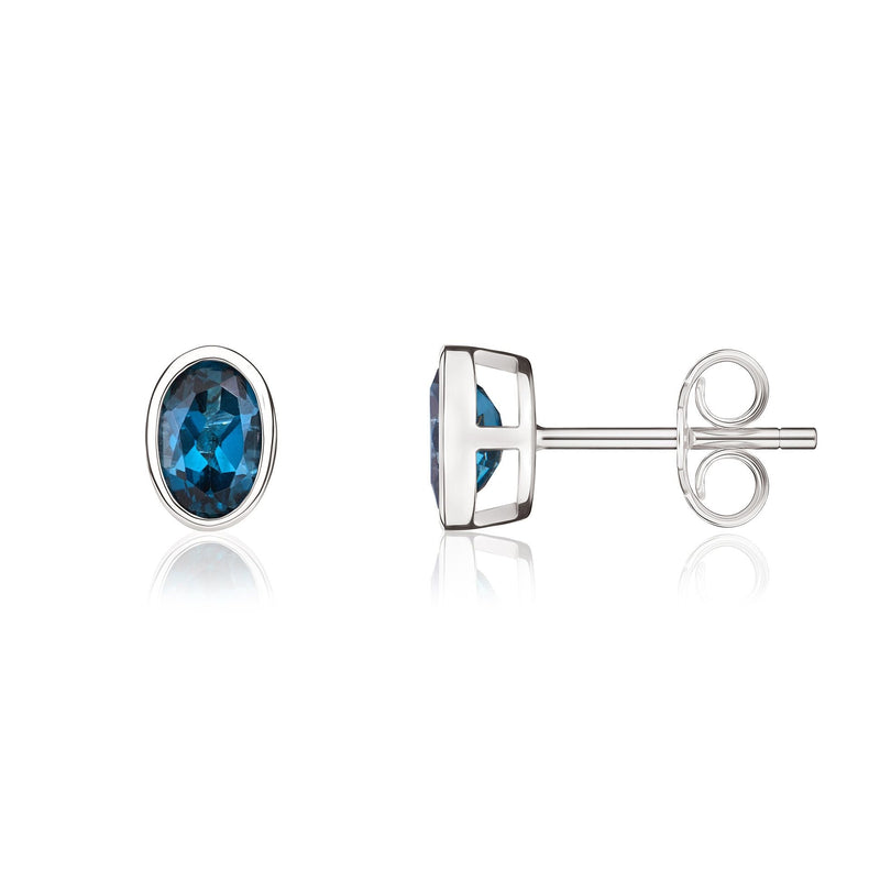 9ct White Gold Oval Natural London Blue Topaz Rubover Stud Earrings — 6x4mm