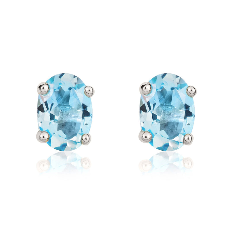 9ct White Gold Oval Natural Swiss Blue Topaz Claw Stud Earrings — 7x5mm