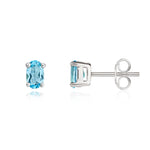 9ct White Gold Oval Natural Swiss Blue Topaz Claw Set Earrings — 6x4mm