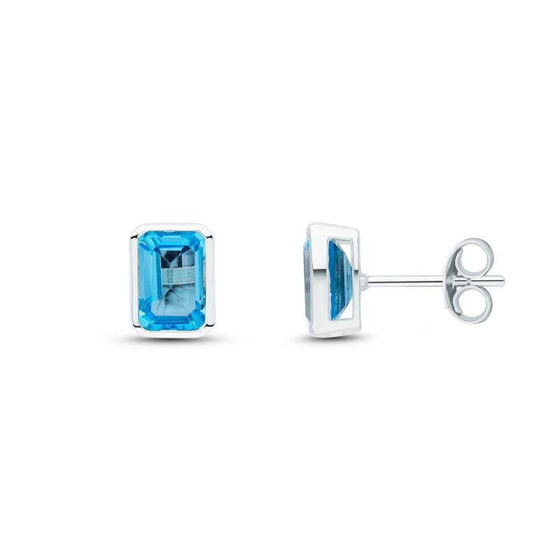 9ct White Gold Octagonal Emerald Cut Natural Swiss Blue Topaz Rubover Stud Earrings — 7x5mm