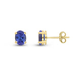 9ct Yellow Gold Oval Natural Tanzanite Claw Stud Earrings — 7x5mm
