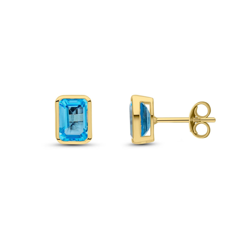 9ct Yellow Gold Octagonal Emerald Cut Natural Swiss Blue Topaz Rubover Stud Earrings — 7x5mm