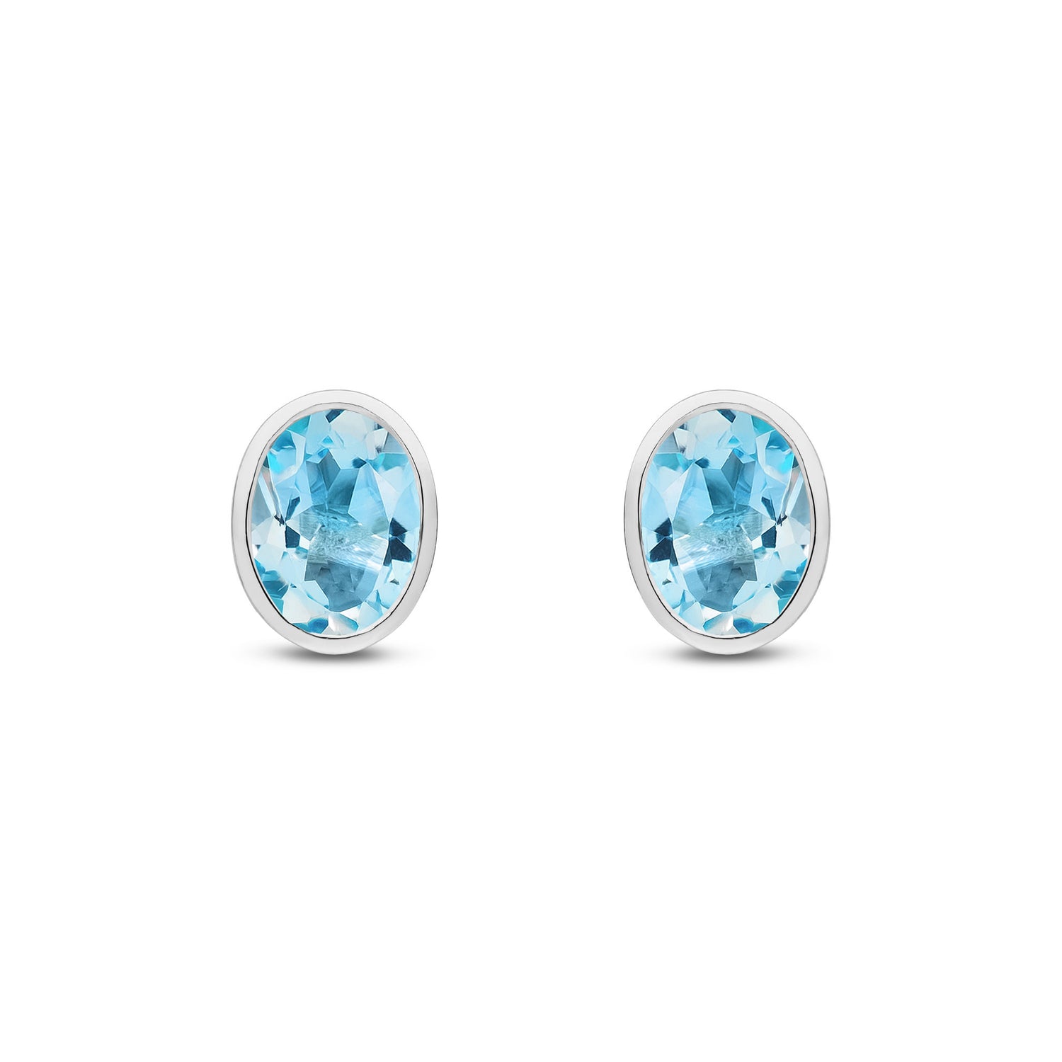 9ct White Gold Oval Natural Swiss Blue Topaz Rubover Stud Earrings — 8x6mm