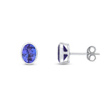 9ct White Gold Oval Natural Tanzanite Rubover Stud Earrings — 7x5mm