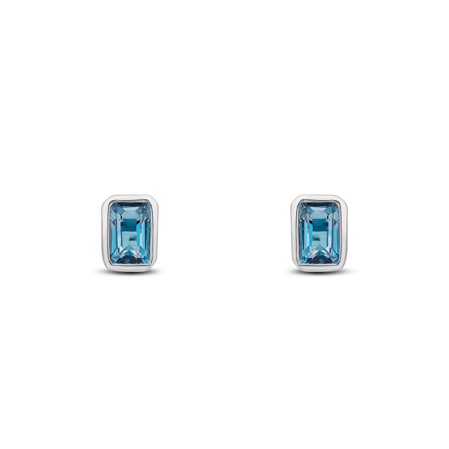 9ct White Gold Octagonal Emerald Cut Natural London Blue Topaz Rubover Stud Earrings — 5x3mm
