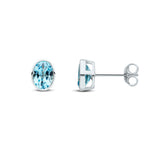 9ct White Gold Oval Natural Swiss Blue Topaz Rubover Stud Earrings — 7x5mm