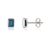 9ct White Gold Octagonal Emerald Cut Natural London Blue Topaz Rubover Stud Earrings — 7x5mm