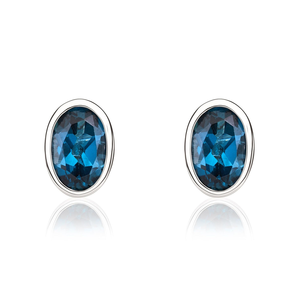 9ct White Gold Oval Natural London Blue Topaz Rubover Stud Earrings — 6x4mm