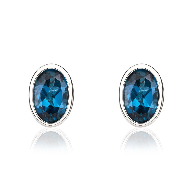 9ct White Gold Oval Natural London Blue Topaz Rubover Stud Earrings — 6x4mm