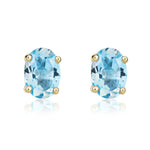 9ct Yellow Gold Oval Natural Swiss Blue Topaz Claw Stud Earrings — 7x5mm