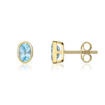 9ct Yellow Gold Oval Natural Swiss Blue Topaz Rubover Stud Earrings — 6x4mm