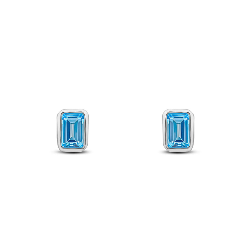 9ct White Gold Octagonal Emerald Cut Natural Swiss Blue Topaz Rubover Stud Earrings — 5x3mm
