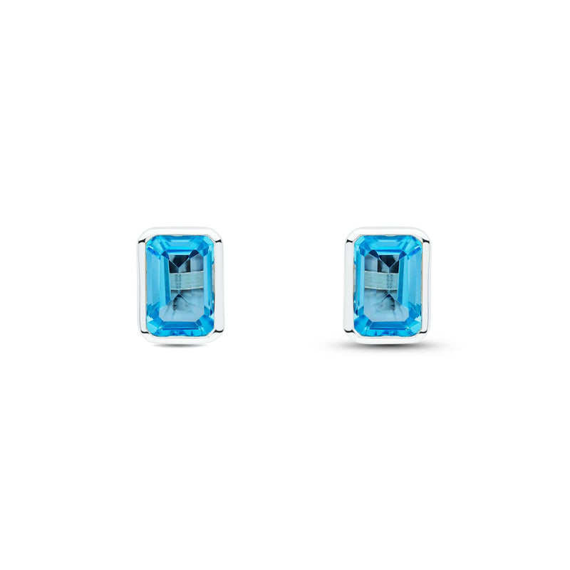 9ct White Gold Octagonal Emerald Cut Natural Swiss Blue Topaz Rubover Stud Earrings — 7x5mm