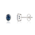 9ct White Gold Oval Natural Sapphire Rubover Stud Earrings — 6x4mm