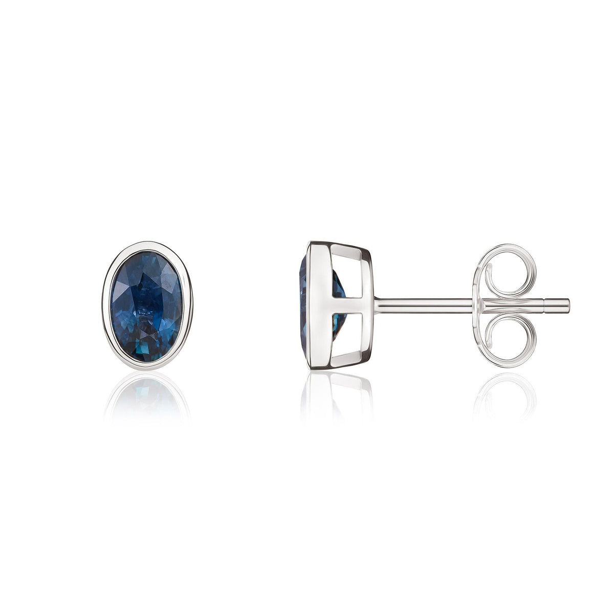 9ct White Gold Oval Natural Sapphire Rubover Stud Earrings — 6x4mm