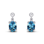 9ct White Gold Oval Natural London Blue Topaz Claw Drop Earrings — 7x5mm
