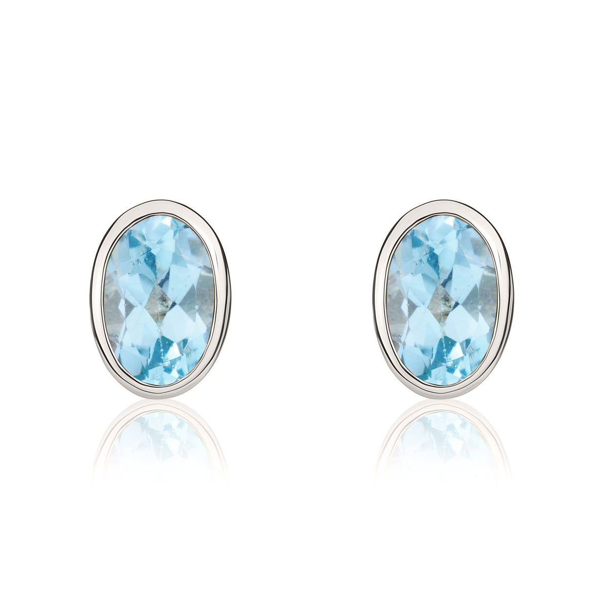 9ct White Gold Oval Natural Swiss Blue Topaz Rubover Stud Earrings — 6x4mm
