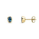 9ct Yellow Gold Oval Natural London Blue Topaz Rubover Stud Earrings — 5x3mm