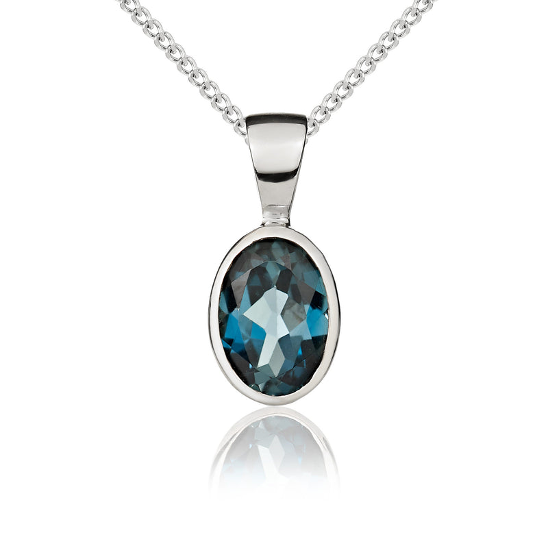 9ct White Gold Oval Natural London Blue Topaz Rubover Pendant — 7x5mm