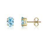 9ct Yellow Gold Oval Natural Swiss Blue Topaz Claw Stud Earrings — 7x5mm